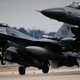 Illustration for article titled Rare photo of two F-16 landing simultaneously in perfect sync